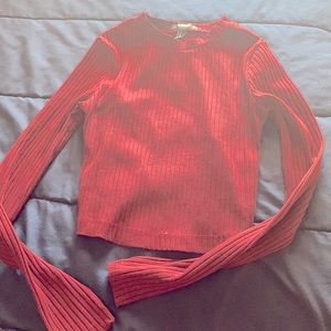 Long sleeve crop top with design opening at the back size M but fits like S